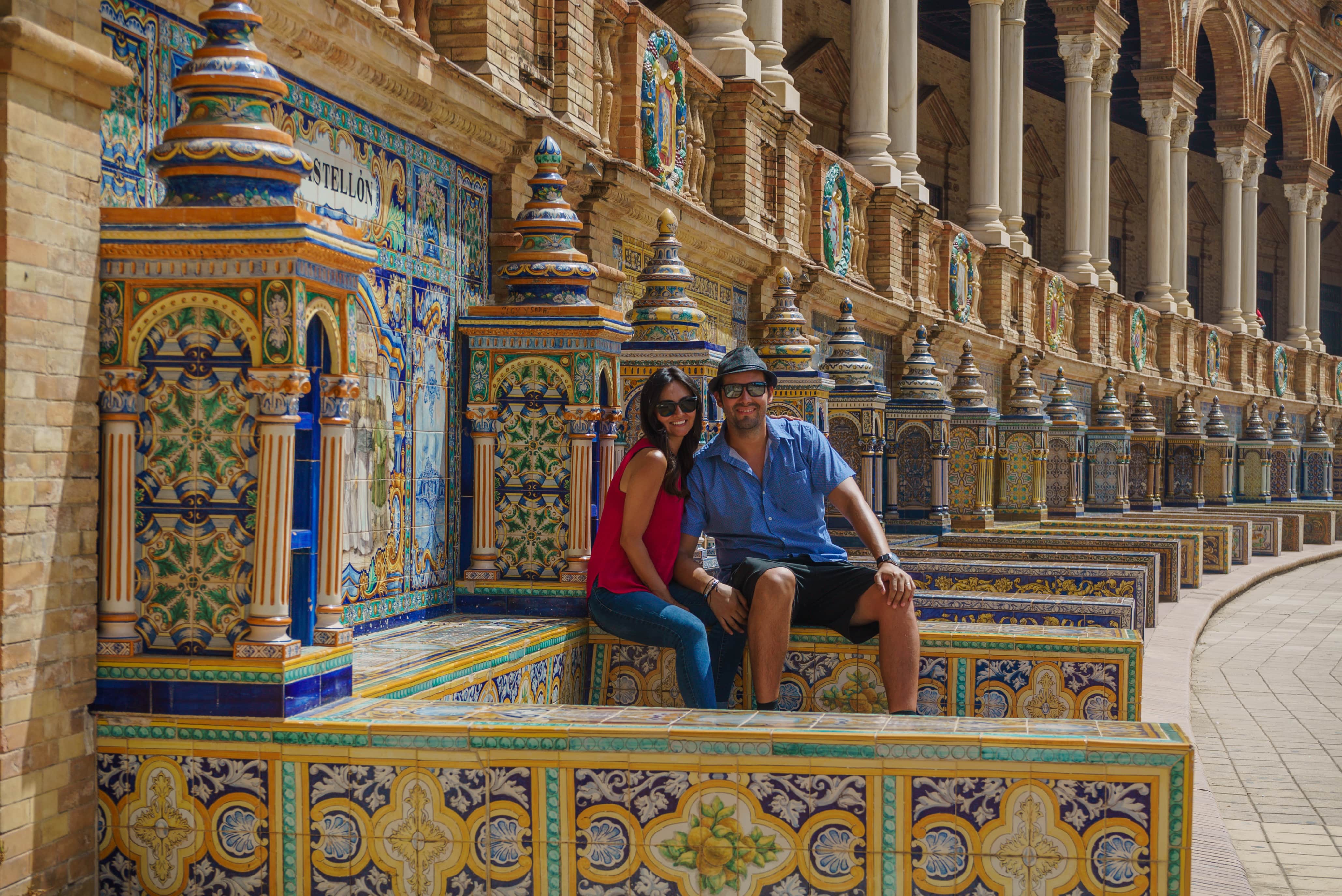 happy couple take photo in Spain Square (Plaza de Espana), Seville, Spain