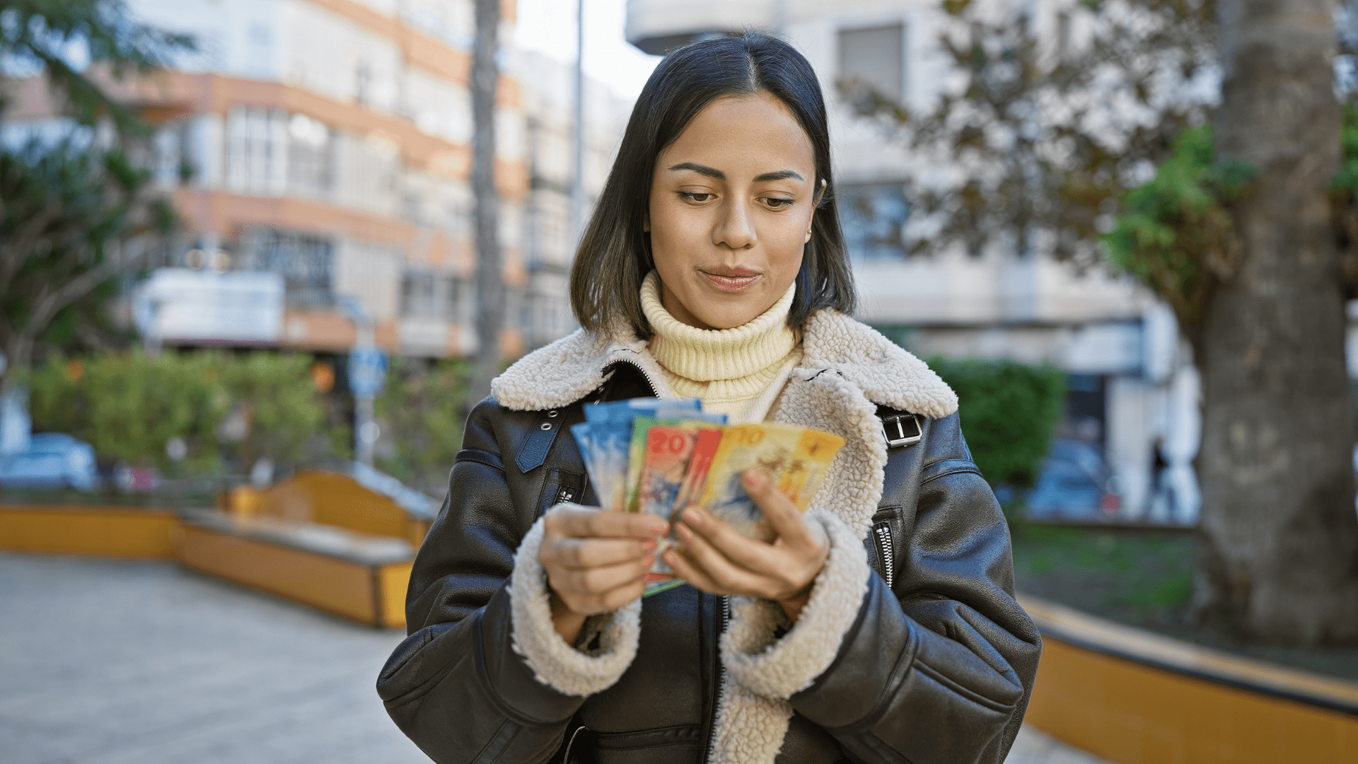 woman counting Swiss franc