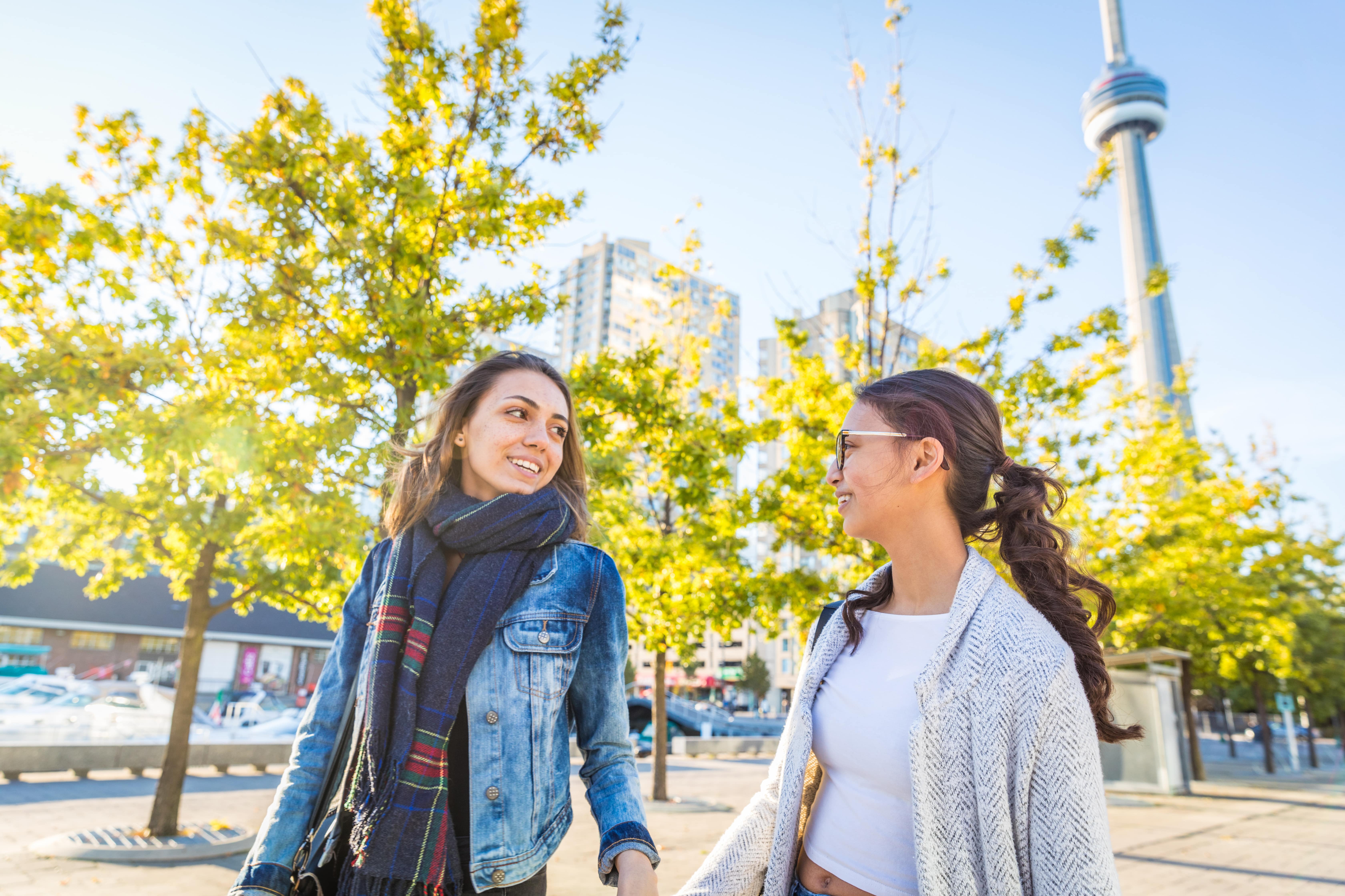 Best friends walking together in Toronto