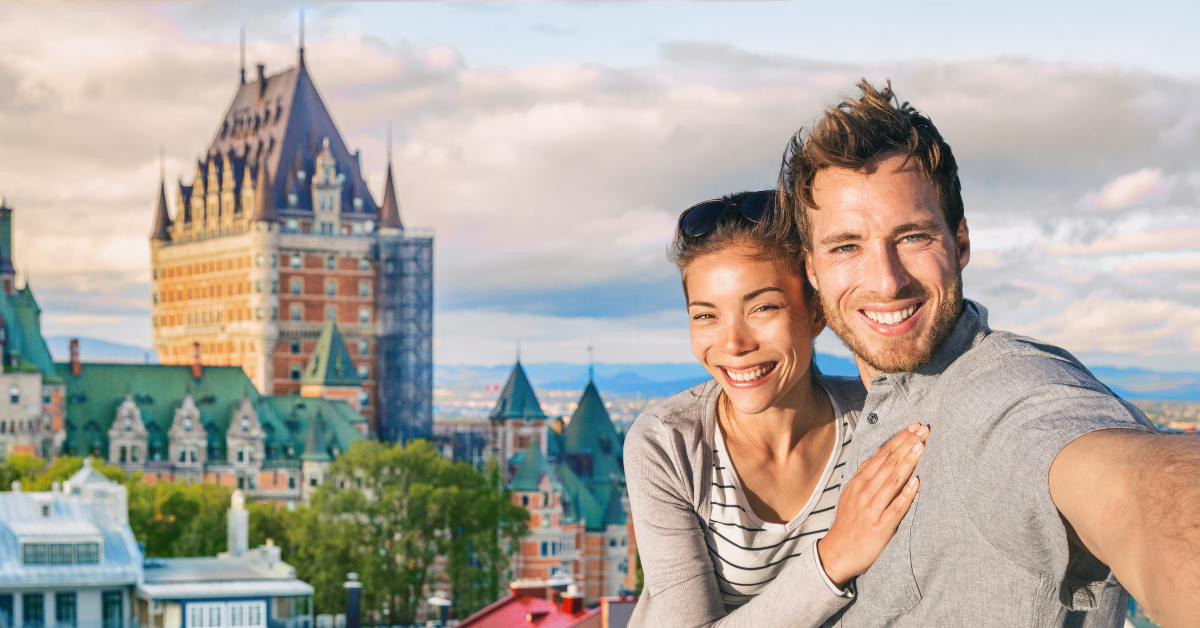 Happy young people at Frontenac Chateau, Old Quebec, Canada