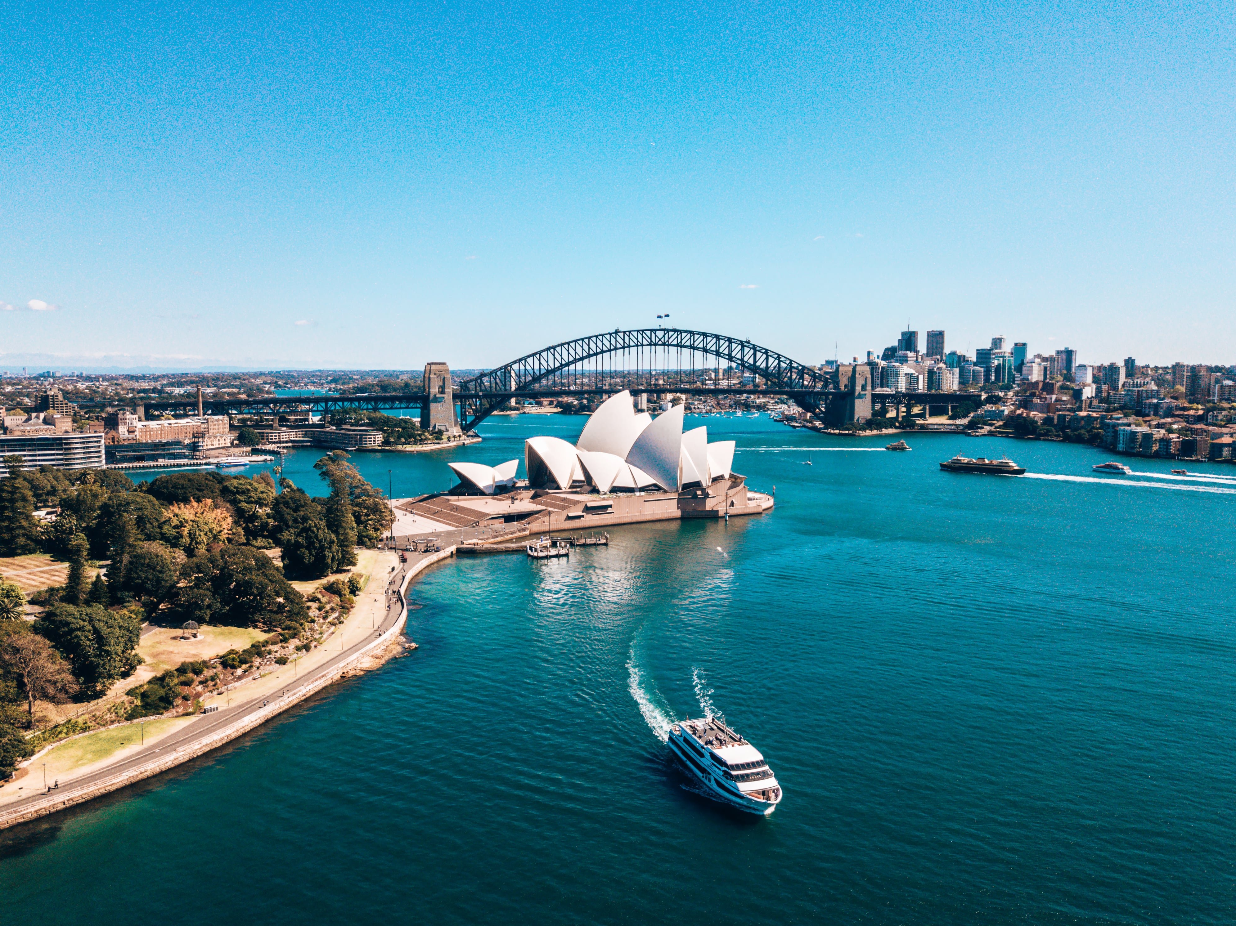 aerial view of Sydney Opera house near Sydney business center around the harbour