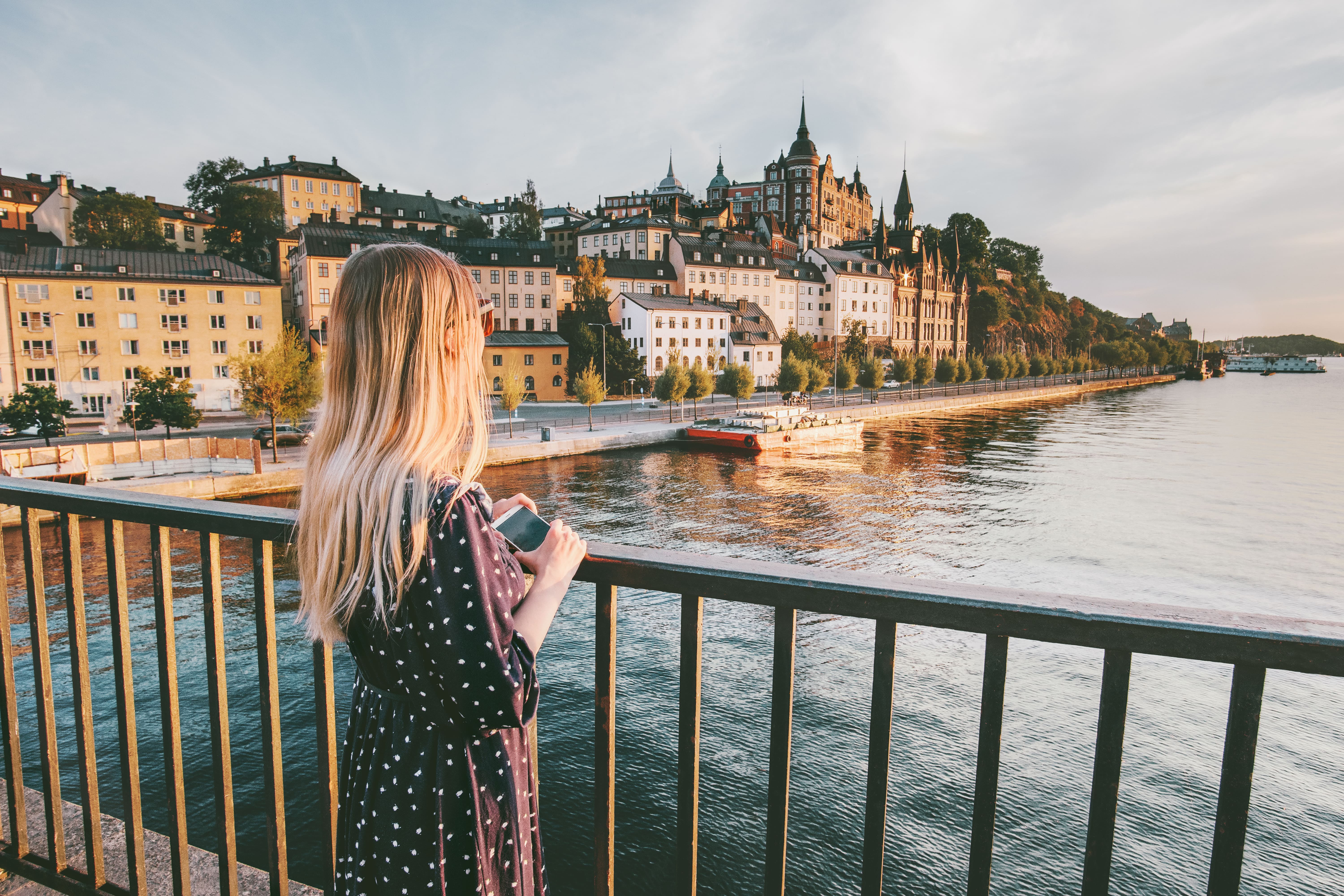 Tourist woman sightseeing Stockholm city enjoying view traveling lifestyle summer vacations in Sweden