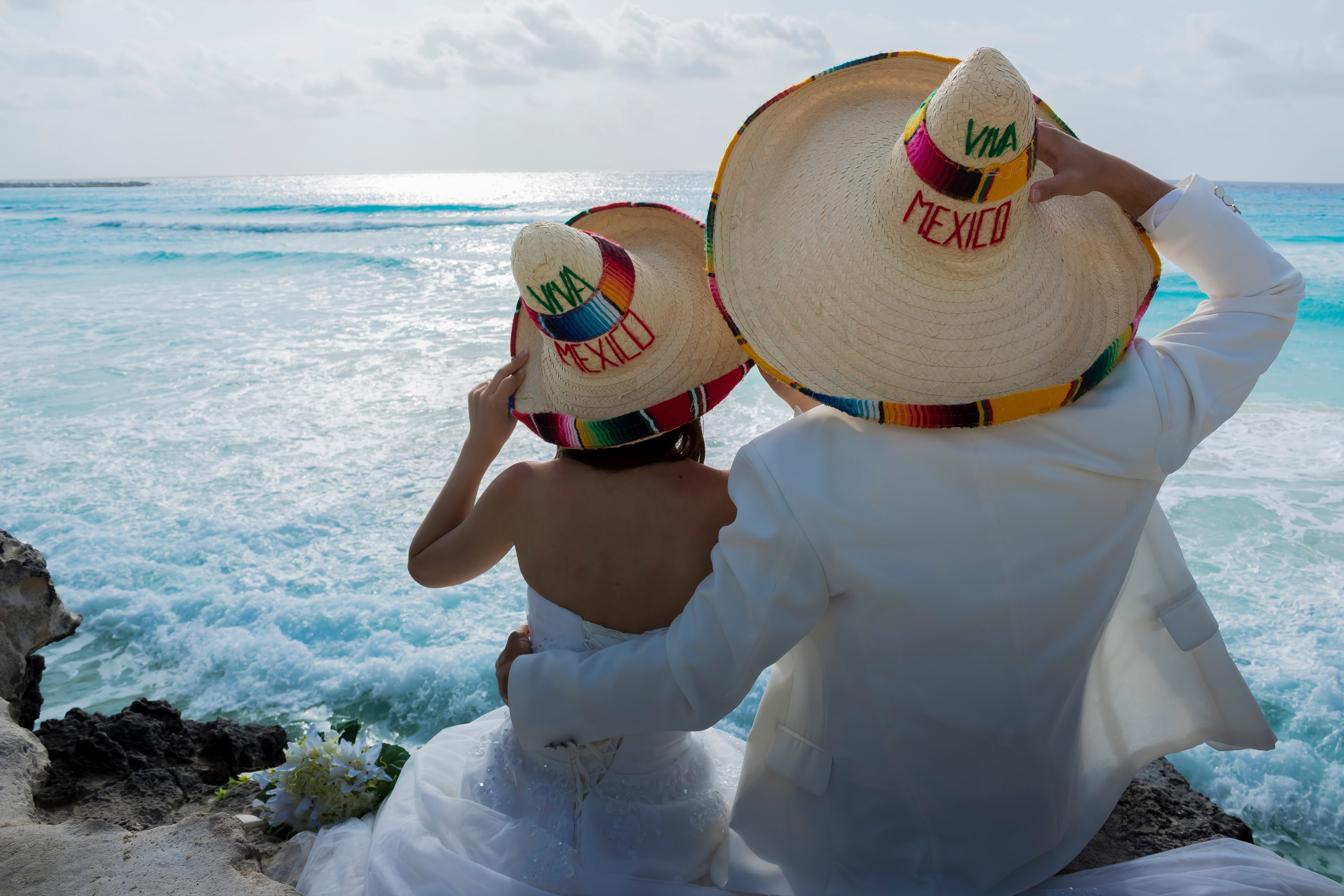 Wedding couple are modeling some mexican charro hat